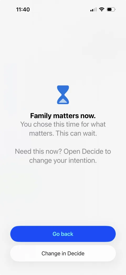 The iPhone shield shown in place of an app that was set aside, reading “Family matters now. You chose this time for what matters. This can wait.”, with a Go back button and a Change in Decide button.